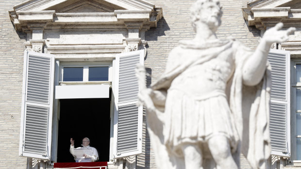 Pope Francis delivers his blessing during the Angelus noon prayer at the Vatican on Sunday.