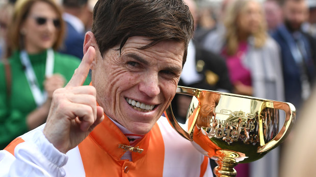 Vow and Declare's jockey Craig Williams declares victory at the 2019 Melbourne Cup.