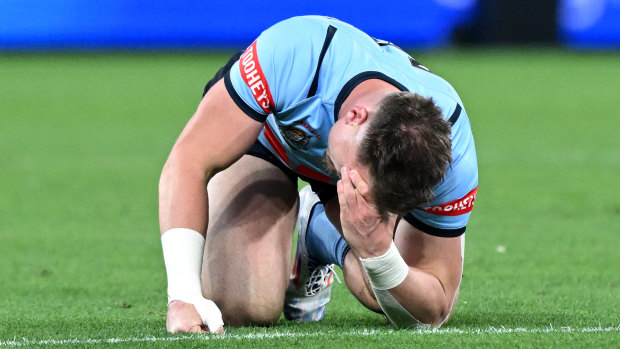 Angus Crichton after hurting his neck early in Origin III.