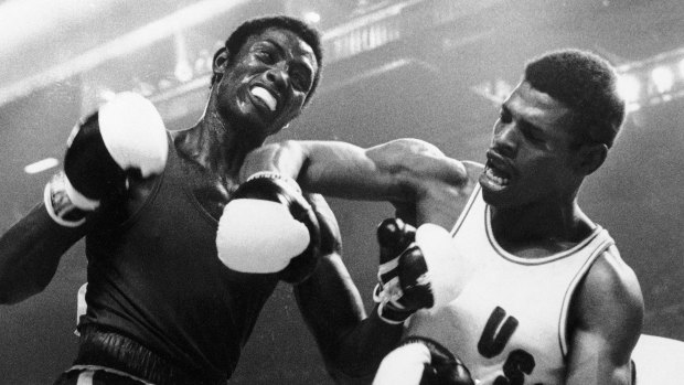 Spinks lets a right fly at Cuba’s Sixto Soria during light heavyweight boxing action at the Olympics in Montreal. 