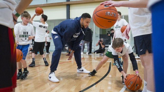 NBA star Ben Simmons practises with kids at his basketball camp in Donvale on Sunday.