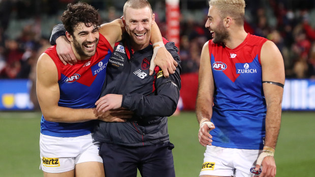 Christian Petracca, Simon Goodwin and Christian Salem celebrate earlier this season.