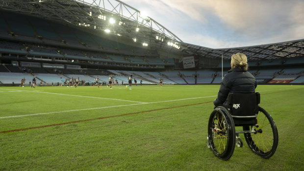 Para surfer Sam Bloom watches NSW training at Accor Stadium.