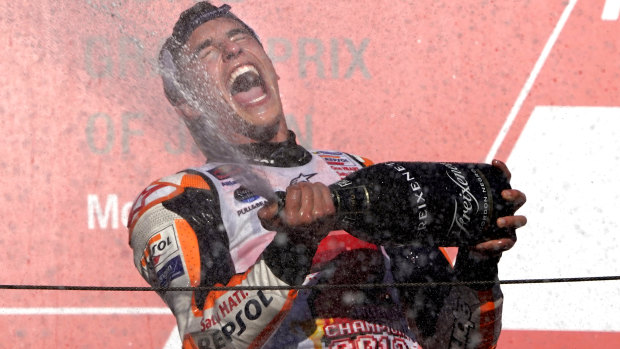 Copping a spray: Spanish rider Marc Marquez celebrates his MotoGP victory in the Japanese Motorcycle Grand Prix at the Twin Ring Motegi circuit in Motegi, north of Tokyo.