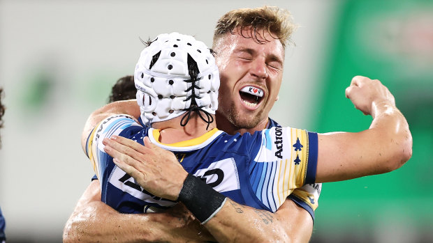 Bryce Cartwright celebrates his try against the Broncos on Friday night.