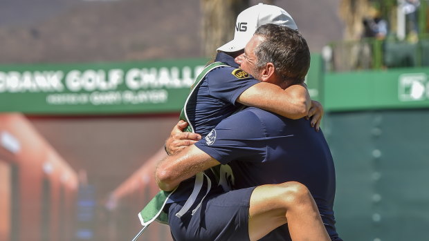 Dream team: Lee Westwood celebrating victory with his caddy and girlfriend Helen Storey.