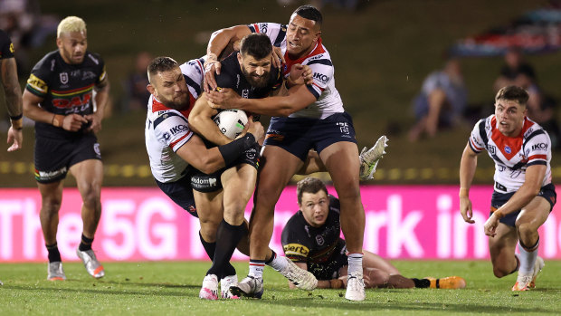 Hard man to stop ... Josh mansour punches through the Roosters defence in their qualifying final.