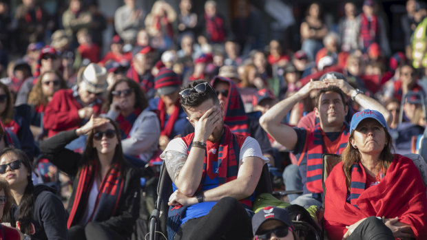 Melbourne fans at Federation Square show their emotions as West Coast streamed to an early lead. 