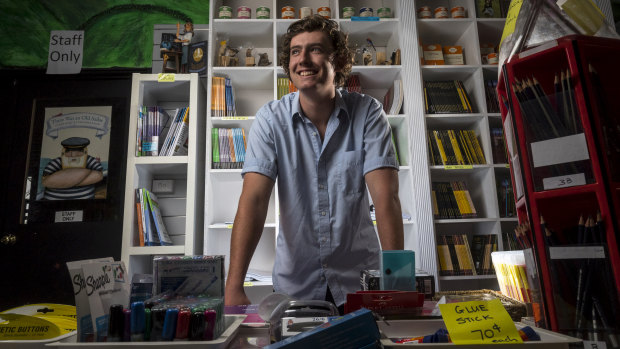 Gus Picking working at his family's bookstore until he starts university next year after he took a gap year to travel. 