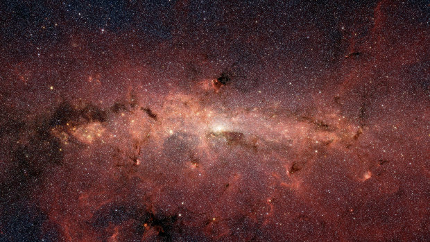 An image provided by NASA and JPL-Caltech shows the Milky Way galaxy. The brightest white spot in the middle is the very centre of the galaxy, which also marks the site of a supermassive black hole.  