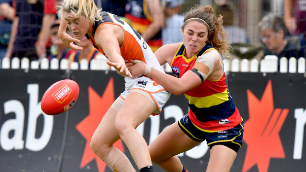 Jenna McCormick (right) has left the Adelaide Crows to return to soccer with Melbourne Victory.