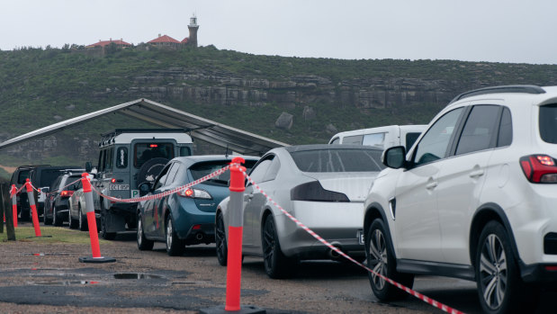 Northern beaches residents queue for COVID-19 checks at Palm Beach. 