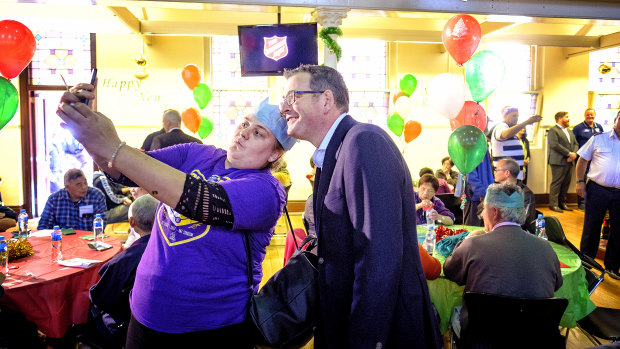 Selfie time: Premier Daniel Andrews  attends the Christmas lunch at the Salvation Army.