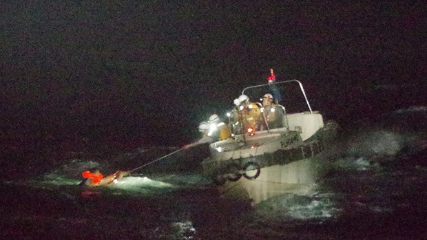 Japan's Coast Guard rescues a Filipino crew member of the Gulf Livestock 1 on Thursday. 