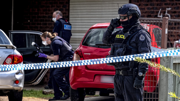 Police stand guard outside the house of Ali's parents home in Werribee in November 2018 after his older brother Hassan Khalif Shire Ali was involved in the Bourke Street terror attack.