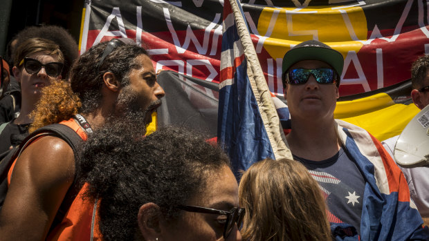 An Invasion Day protester shouts at a far-right nationalist  after he refused to move off the Flinders Street steps during the Invasion Day march. 