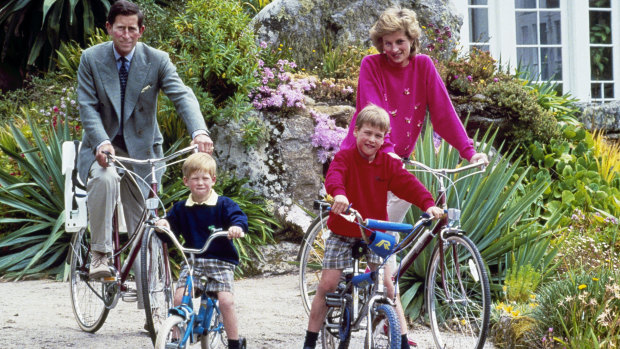 The Duke of Sussex (bottom, left) as a boy with his brother, Prince William, and their parents, the Prince and Princess of Wales.