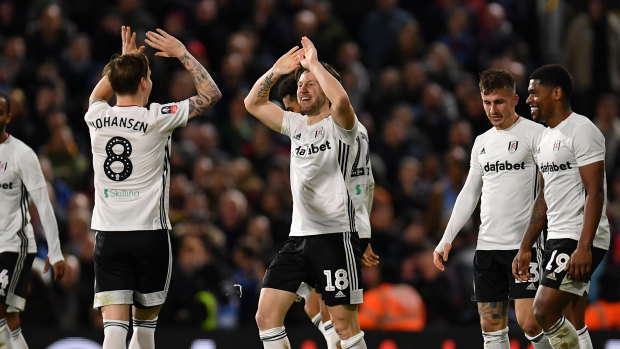 Harry Arter celebrates with his Fulham teammates after scoring against Aston Villa at Craven Cottage.