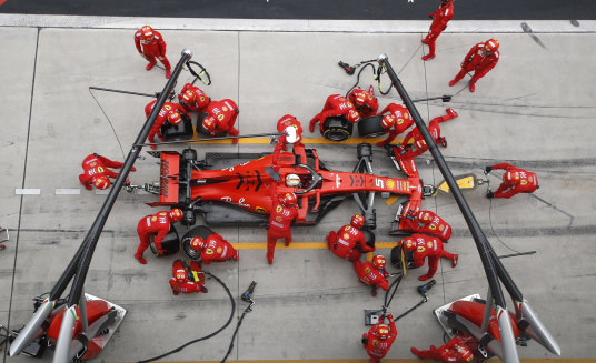 Ferrari driver Sebastian Vettel of Germany makes a pit stop during the Chinese Formula One Grand Prix.