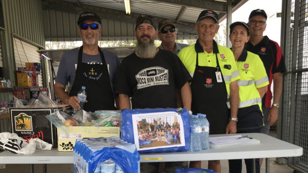 Fassifern Valley Salvation Army volunteer coordinator Allen Stibbe and some of the fruit, water and biscuits they are happy to receive to help the firies.