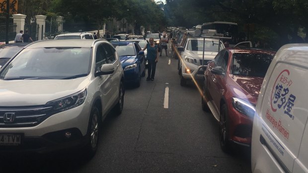 Motorists leave their cars on Alice Street.