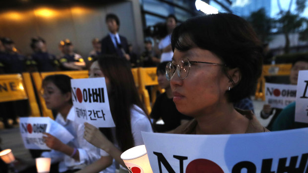 South Koreans protest the Japanese government's decision to restrict exports to their country in front of the Japanese embassy in Seoul.