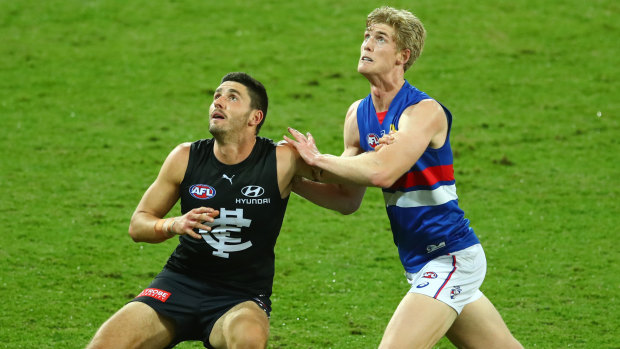 Ruck stars: Carlton's Marc Piitonet goes up against his Bulldog counterpart Tim English.