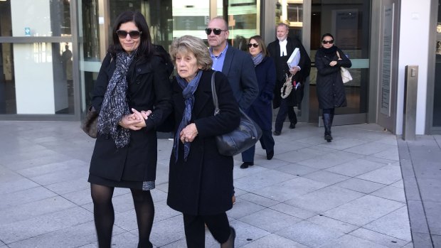 The family of Zacharias Andreou leaving Parramatta District Court.