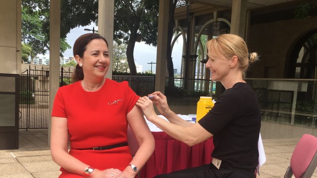 Queensland Premier Annastacia Palaszczuk gets a flu shot on Tuesday.