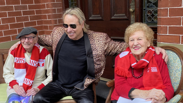 Long-time Sydney Swans fans and siblings, 102-year-old James Lindesay and 97-year-old Joyce Schirrman get a surprise visit from Warwick Capper