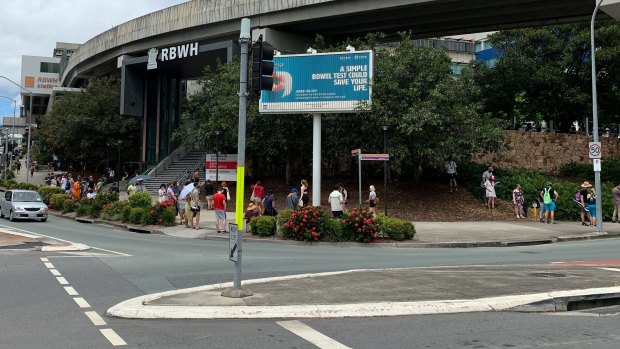 The queue for PCR COVID-19 tests at the Royal Brisbane and Women’s Hospital stretches from O’Connell Terrace to Butterfield Street on Tuesday.