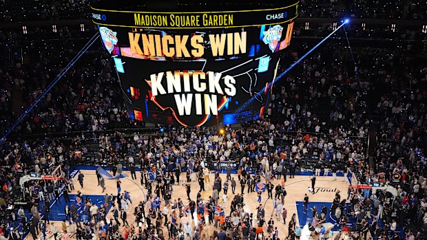 Players and fans celebrate after the New York Knicks’ game four win over San Antonio.