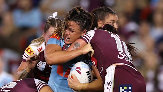NSW prop Millie Elliott takes a hit-up against Queensland in Origin I.
