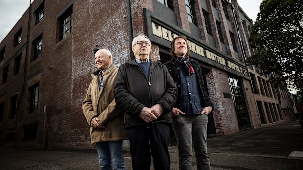 Record producers Ernie Rose (left) and Roger Savage, with researcher and author John Olson (right) outside the former Armstrong Studios site in South Melbourne.