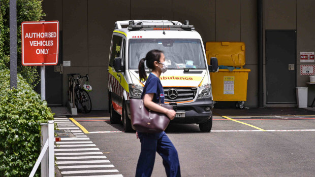 Public health worker walk past the ambulances parked in the emergency bay at St Vincent’s Hospital in Darlinghurst, Sydney on Jan 12, 2022. Generic of covid.  Photo: Flavio Brancaleone/The Sydney Morning Herald  Photo: Flavio Brancaleone/The Sydney Morning Herald