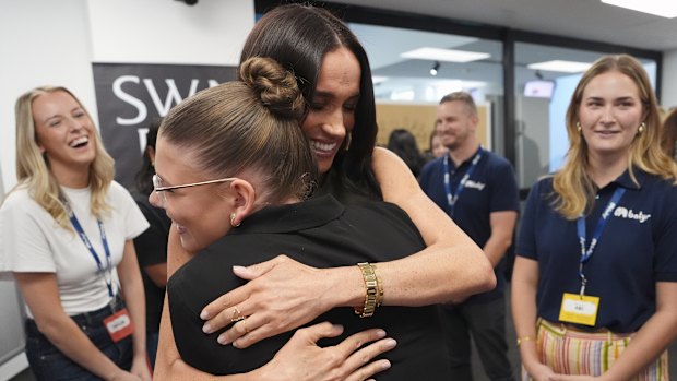 Meghan, pictured here at Swinburne University in Melbourne on Thursday, has had just as much of a warm reception in Australia as her husband.