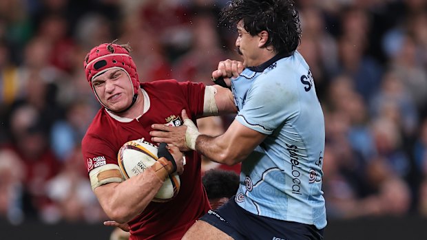 SYDNEY, AUSTRALIA - JULY 05: Josh van der Flier of the British and Irish Lions is tackled during the tour match between NSW Waratahs and British & Irish Lions at Allianz Stadium on July 05, 2025 in Sydney, Australia. (Photo by Cameron Spencer/Getty Images)