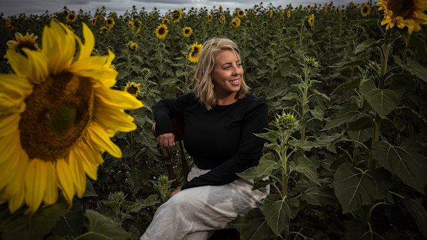 Hoping for a good season: Farmer Britt Laiken takes a break at Pick Your Own Sunflowers. 