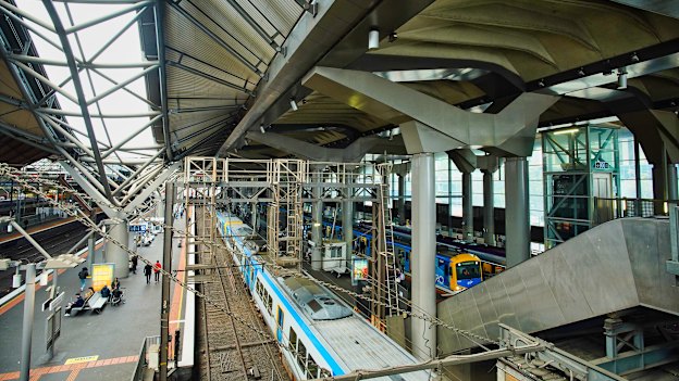 The undulating, wave-like roof on the left gives way to a flatter concrete roof on the right.