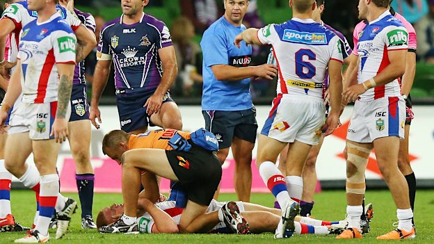 Alex McKinnon on the ground after the tragic tackle in 2014 in Melbourne.