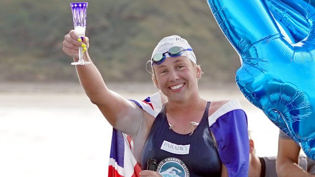 McCardel celebrating breaking 
the record last year, with her 44th crossing.