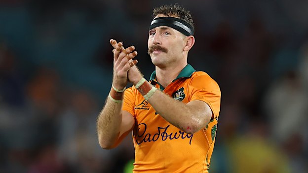 Nic White applauds the fans after being substituted off in the third Lions Test – which was supposed to be his last for the Wallabies.