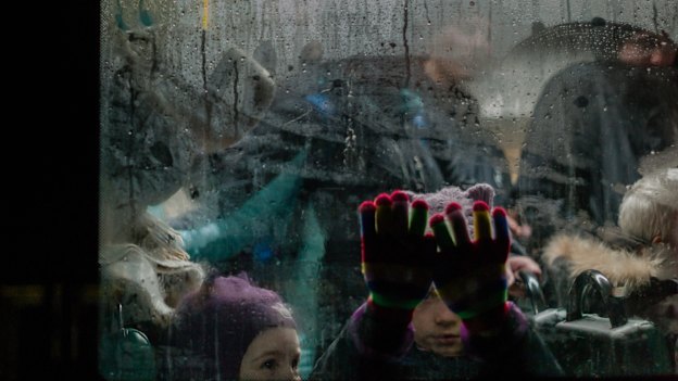 People arrive in Zaporizhzhia, near the nuclear power plant attacked by Russian forces, to receive aid on March 9.

