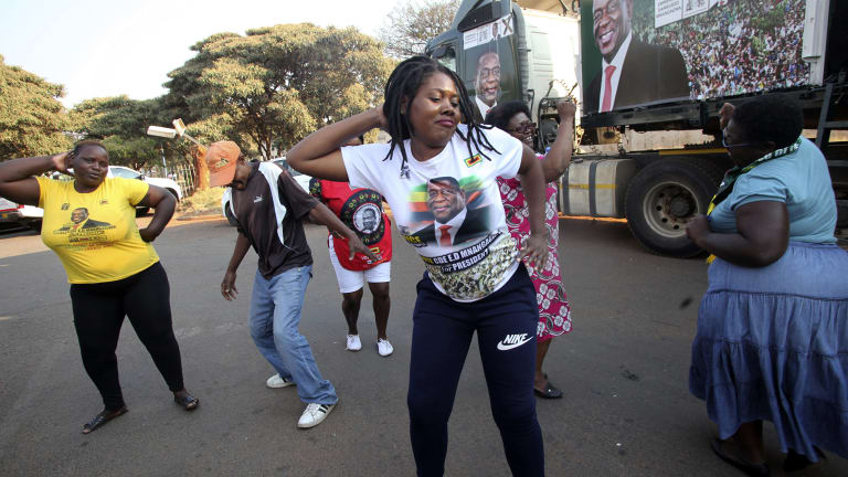 Supporters of Zimbabwean President Emmerson Mnangagwa celebrate in Harare.