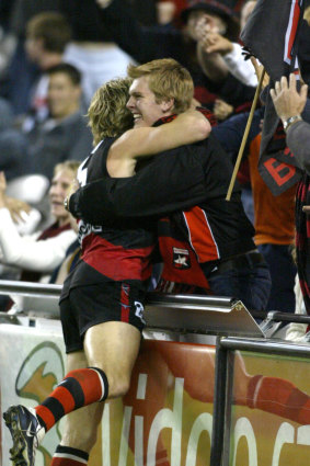James Hird rushes to his supporters after he scores the winning goal.