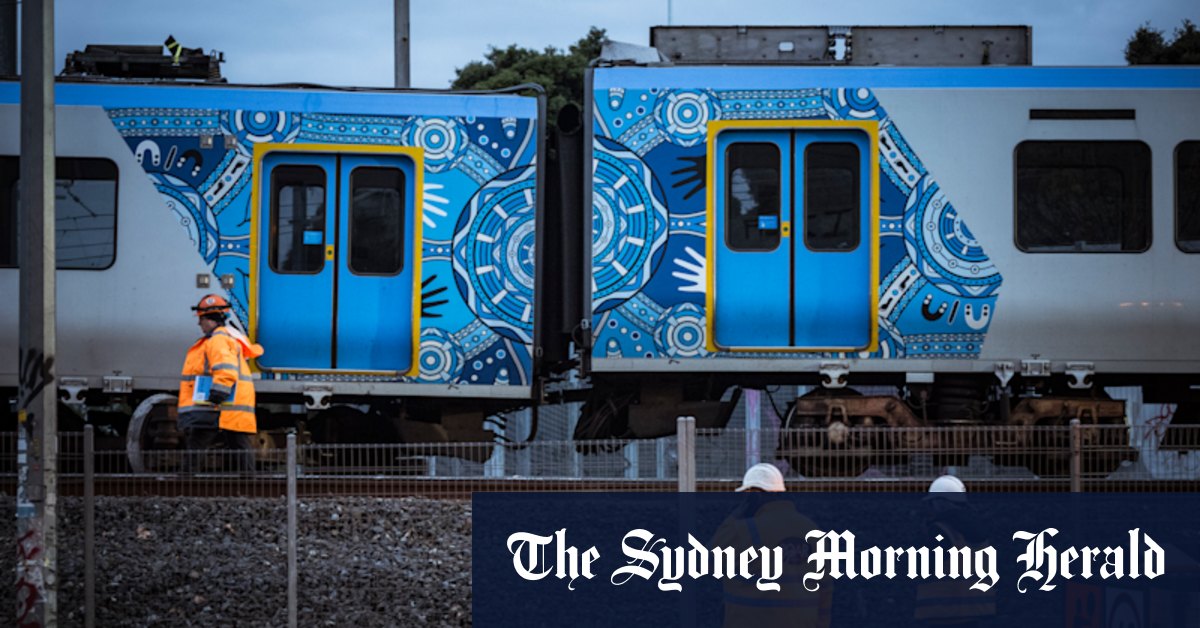 Key train lines remain suspended as a crane arrives to lift carriage derailed at Clifton Hill