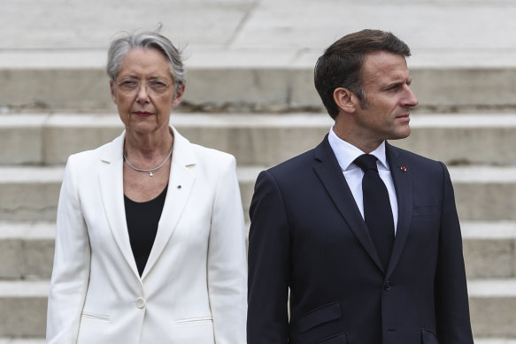 French President Emmanuel Macron and outgoing PM Elisabeth Borne.