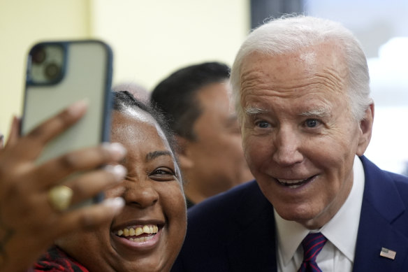 US President Joe Biden poses for a photo as he visits CJ’s Cafe in Los Angeles on Wednesday.
