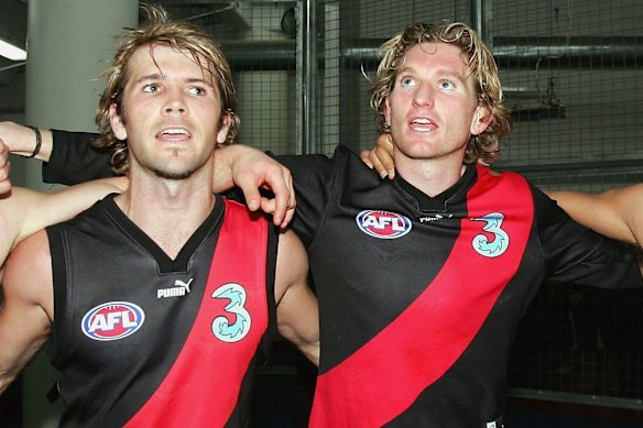 Great mates and former teammates Mark McVeigh and James Hird in 2004.