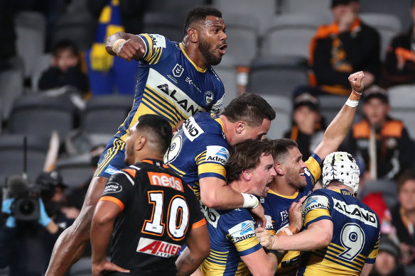 Will Smith celebrates a try with his teammates.